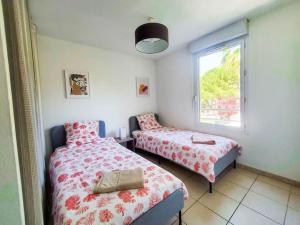 Appartements *Le Carpe Diem, Appartement 2 chambres, piscine, 2 Parking, Clim* : photos des chambres