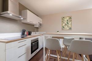 Appartements Les 70's Dutreix : photos des chambres