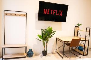 Appartements NG SuiteHome - Lille I Roubaix Barbieux I Croix - Balneo - Relax area - Netflix - Wifi - Kitchenette : photos des chambres