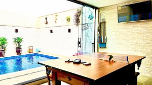 Piscina com ofurôChurrasqueiraSinuca e Ping Pong