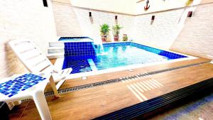 Piscina com ofurôChurrasqueiraSinuca e Ping Pong