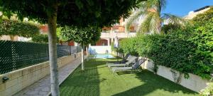 Homes of Spain, Apartamentos Paraíso Vera Playa, Ed Nuku Hiva, Bajo X con PISCINA PRIVADA y jardín privado a PIE de PLAYA , WIFI