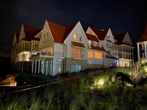 Familie beachhuis op de duinen (Duinhuis)