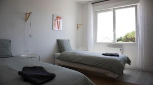 Appartements Appartement avec jardin BELLADONA : photos des chambres