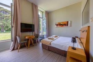 Hotels Hotel et SPA du Chateau : photos des chambres