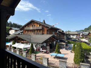 Appartement cosy au centre des Gets, 2 balcons, 2 chambres, proche remontées mécaniques, parking inclus - FR-1-623-297