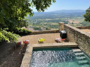 Maisons de vacances Maison de village avec vue panoramique et piscine : photos des chambres