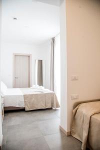 Deluxe Triple Room with Balcony and Lateral Sea View