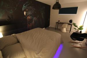 Appartements Bienvenue chez DaLo, jacuzzi, art et modernite : photos des chambres