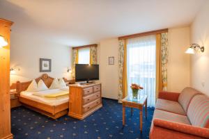 Double Room with Balcony (2 Adults + 1 Child) room in Hotel Hammerwirt - Forellenhof