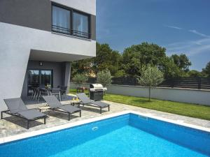 Modern villa with heated swimming pool and fenced garden