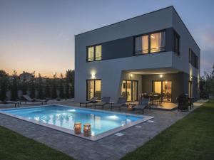 Modern villa with heated swimming pool and fenced garden