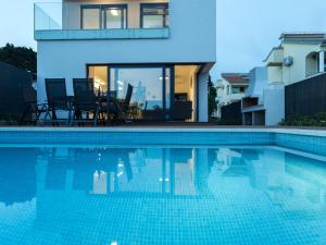 Luxury villa with private heated pool and sea view, only 100m from the beach