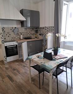 Appartements Au coeur du village : photos des chambres