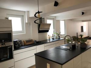 Appartements Les Delices de l'Ancien College : photos des chambres
