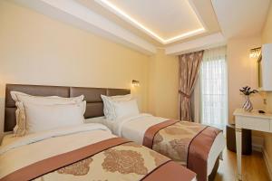 Standard Triple Room room in Grand Naki Hotel