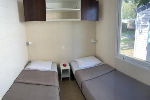 Appartements Mobil Home camping Tohapi en Alsace : photos des chambres