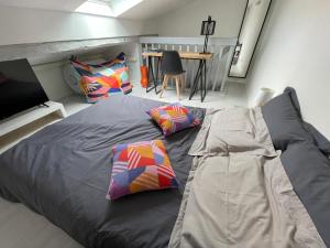 Appartements Au pigeonnier : hyper centre + Clim + parking gratuit : photos des chambres