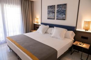  Deluxe Room with balcony and Partial Sea View room in URH Sitges Playa