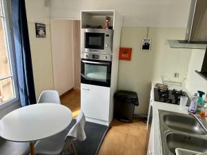 Sejours chez l'habitant Aubervilliers maison de ville pres metro 7 : photos des chambres