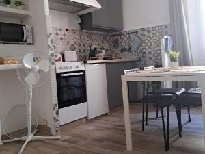 Appartements Au coeur du village : photos des chambres