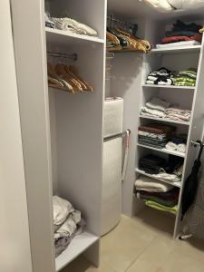 White and Bright Riverside View Flat with Parking, Bike Access, and Onsite Gym