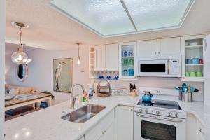 Modern oceanfront condo with two pools & private washerdryer