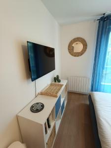 Appartements Studio Cosy neuf + lit bebe a 4 minutes RER A : photos des chambres