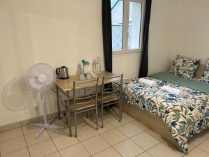 Maisons de vacances L'ideal sejour avec jardin prive proche Paris gare et commerce : photos des chambres