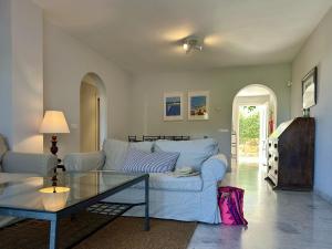 Blue House in Guadalmina Baja, with a large terrace overlooking the Golf