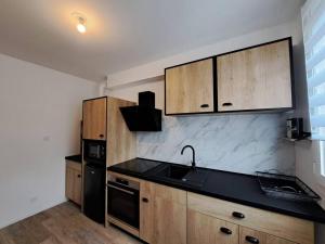 Appartements Camden - Exterieur et parking : photos des chambres