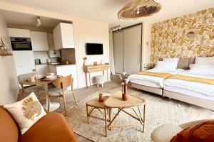 Appartements Le Nichoir de la Colline - Parking & Wifi : photos des chambres