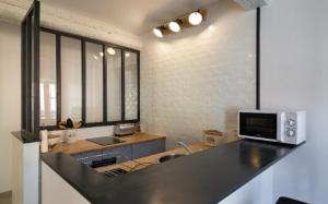 Appartements Studio Carignan : photos des chambres