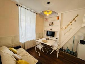 Appartements Le Champagne Coquebert - Centre-ville : photos des chambres