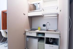 GuestHost - Veiled Christ Apartments