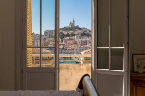 Appartements Splendide vue sur ND de la Garde et le Vieux Port : photos des chambres