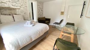 Appartements La Douce Angevine - La Perruche - Proche centre : photos des chambres
