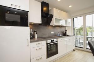 Modernen Ferienwohnung mit Balkon, Kamin - Alte Fischfabrik Lauterbach FeWo 13