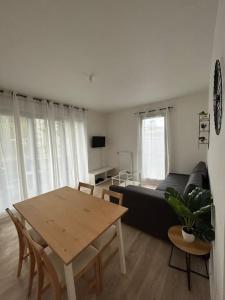 Appartements Appartement cosy avec jardin : photos des chambres