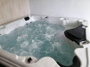 Maisons de vacances Maison familiale avec jacuzzi : photos des chambres