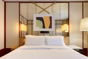 Deluxe Double Room room in Le Belgrand Hotel Paris Champs Elysees Tapestry By Hilton