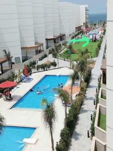 شاليه فندقي أرضي بحديقه خاصه في منتجع بورتوسعيد