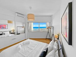 1BR Seafront Apt with community pool