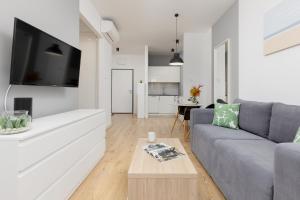 Wola Pet-friendly Apartments with AC Sławińska by Renters