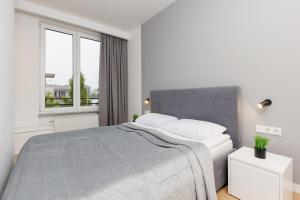 Wola Pet-friendly Apartments with AC SÅ‚awiÅ„ska by Renters