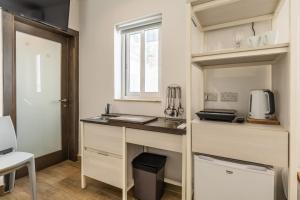 Studio apartment with twin beds & kitchenette at the new Olo living 24