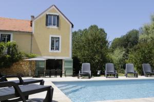 Maisons de vacances Logement cosy avec piscine partagee dans le bourg : photos des chambres