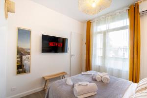 Appartements L'Ete - Netflix & Wifi - Balcon - Parking Gratuit - Emplacement Velo Securise : photos des chambres