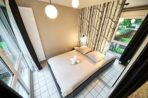 Appartements Le petit Bourbonnais - patio privatif- metro Valmy : photos des chambres