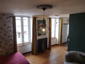 Appartements De Vert et d'Or - proche gare - parking - jardin : photos des chambres